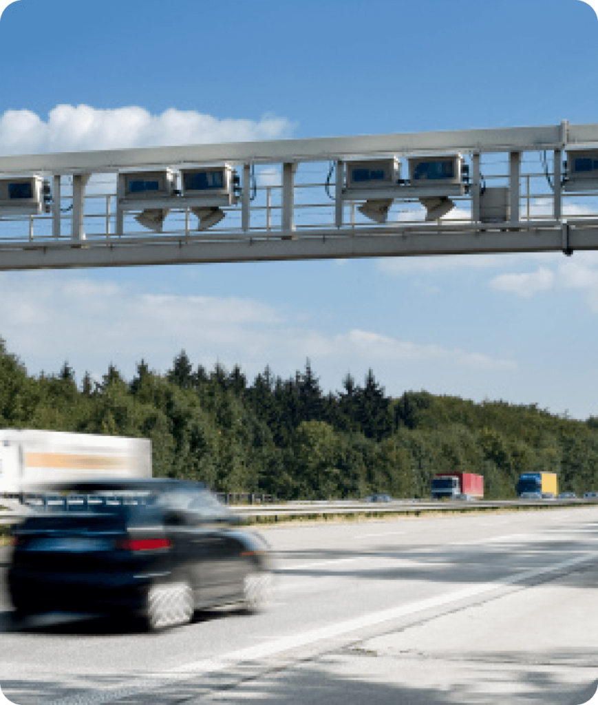 image of a car driving through a toll road