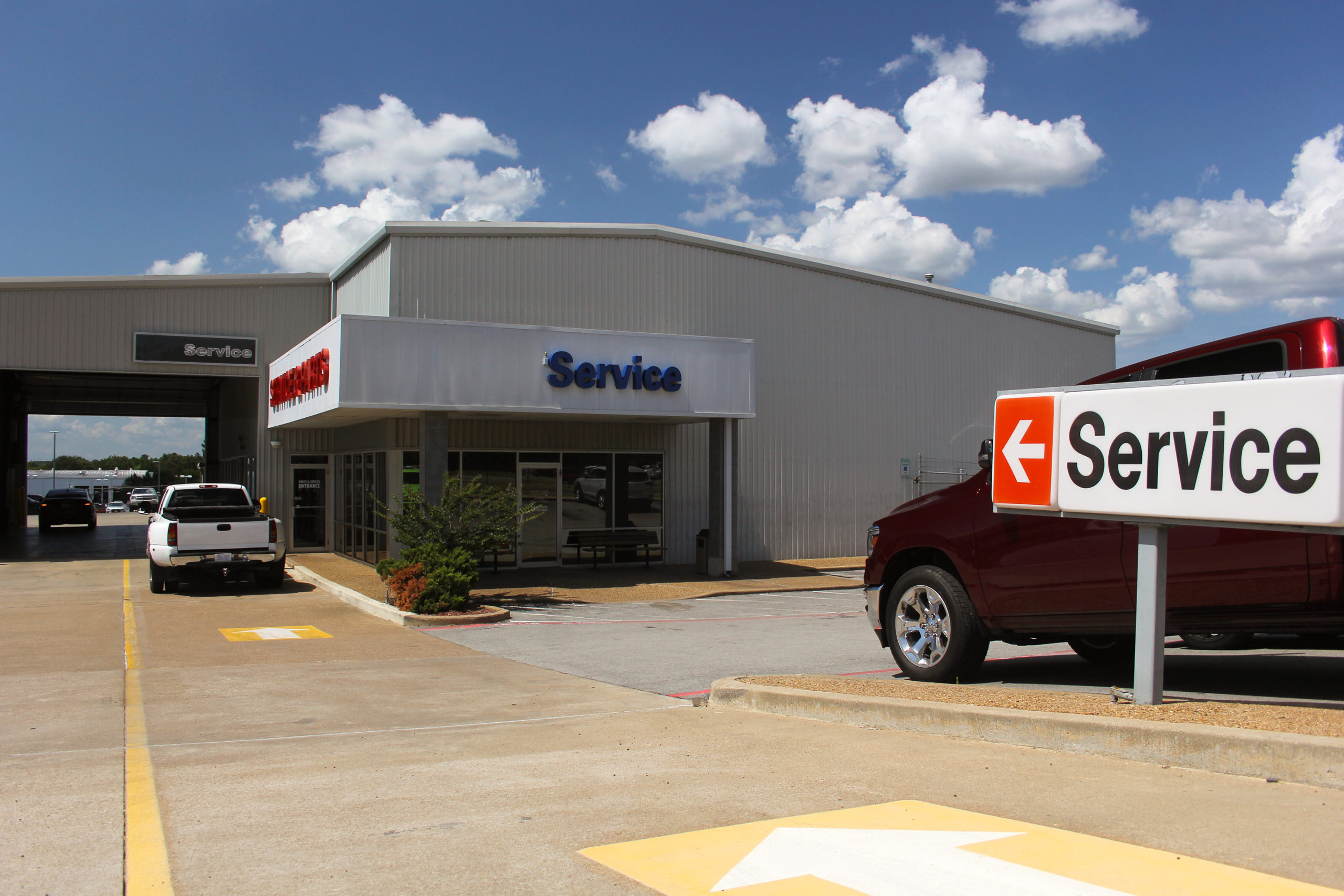 Car dealership service department sign